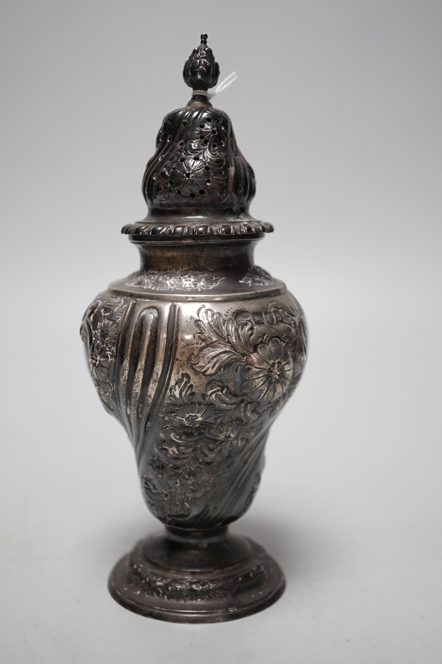 A late Victorian embossed silver inverted pear shaped sugar caster, Harris Brothers, London, 1897, 19.8cm, 7.5oz.